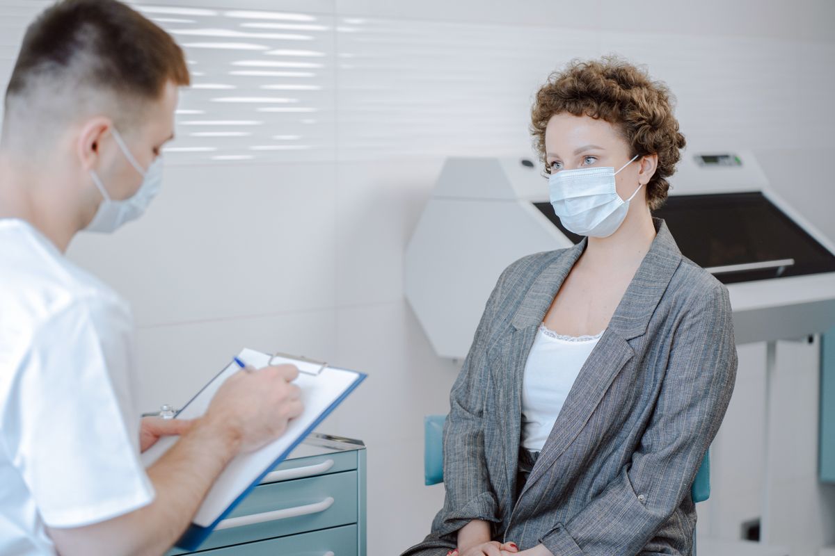 A doctor and patient talking during an office consultation