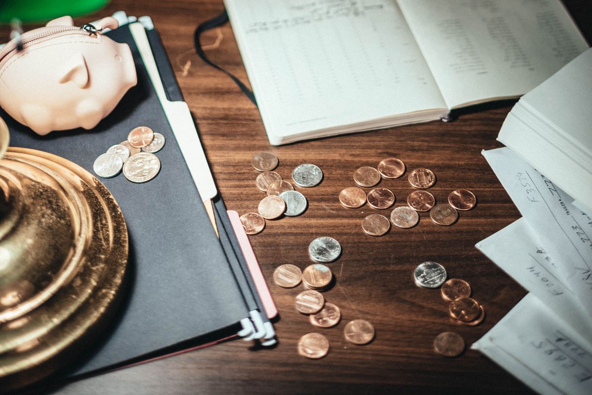 Coins on a wooden surface for tracking savings